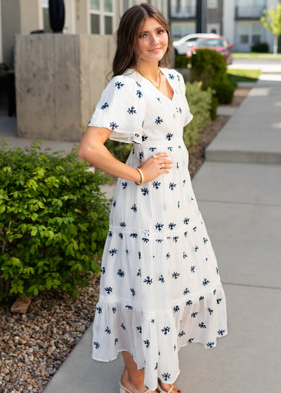 Side view of the white embroiered dress