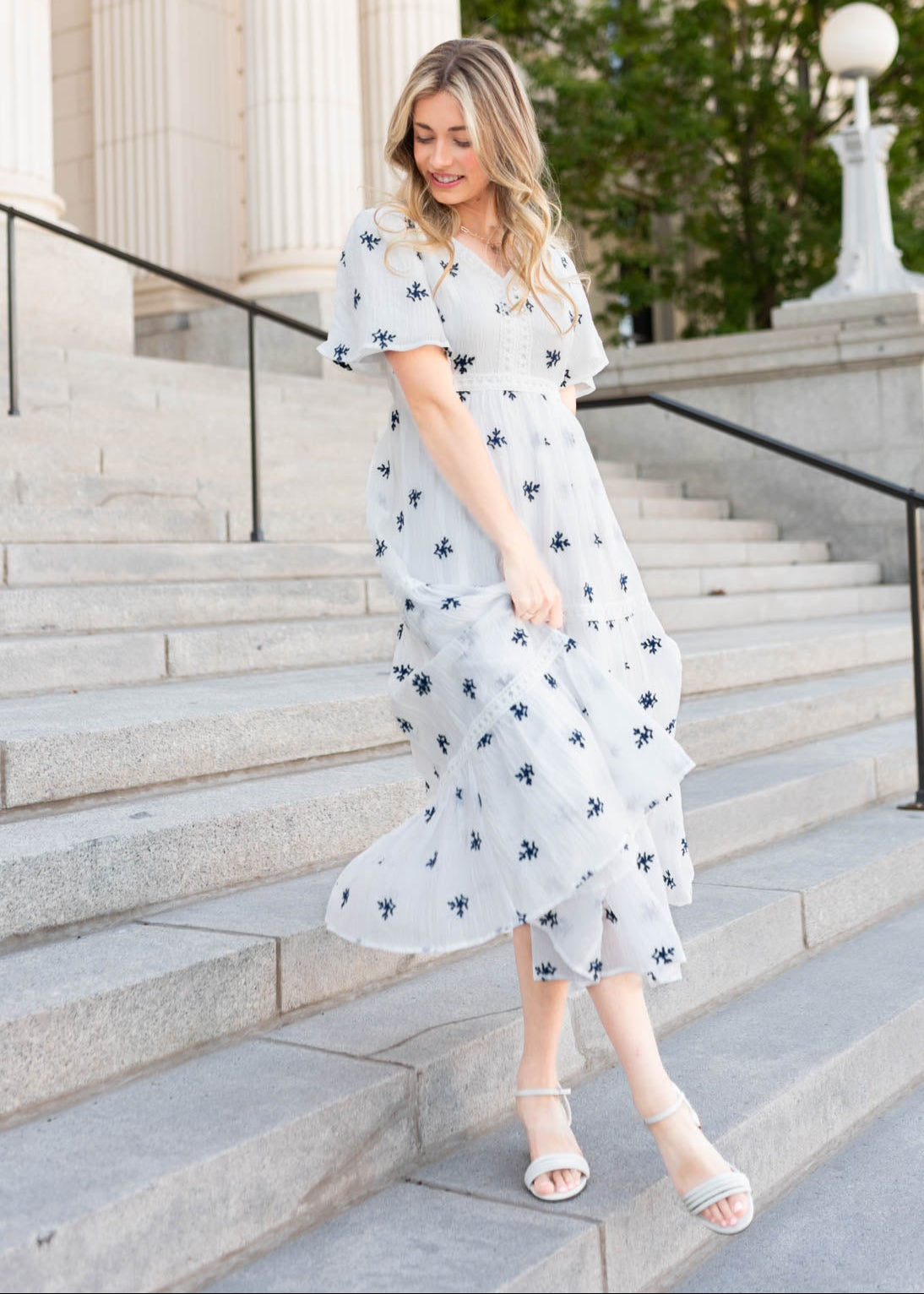 White embroidered dress with blue flowers