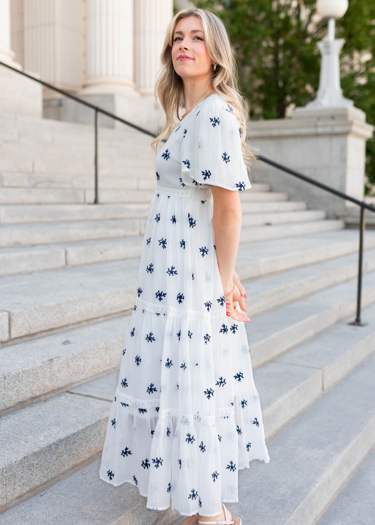 Side view of the white embroidered dress