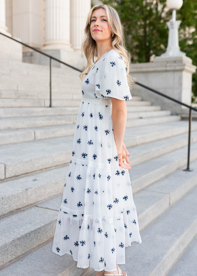 Side view of the white embroidered dress