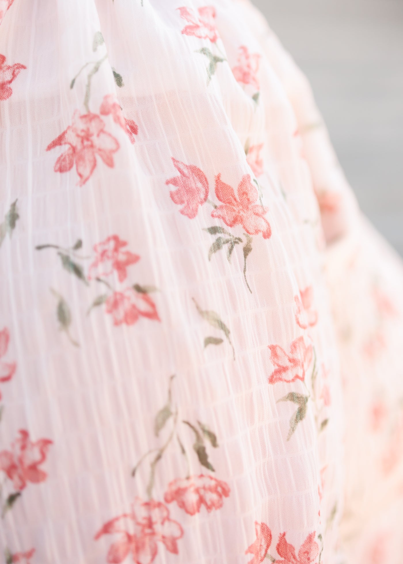 Close up of the fabric on the pink floral tiered dress