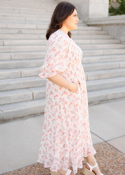 Side view of the plus size pink floral tiered dress