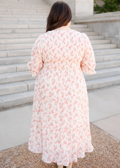 Back view of the plus size of the pink floral tiered dress with smocked bodice