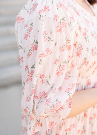 Close up of the sleeve and fabric on the pink floral tiered dress