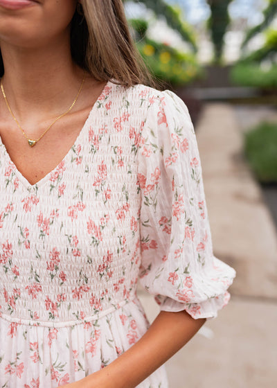 Close up of the sleeve and fabric on the pink floral tiered dress