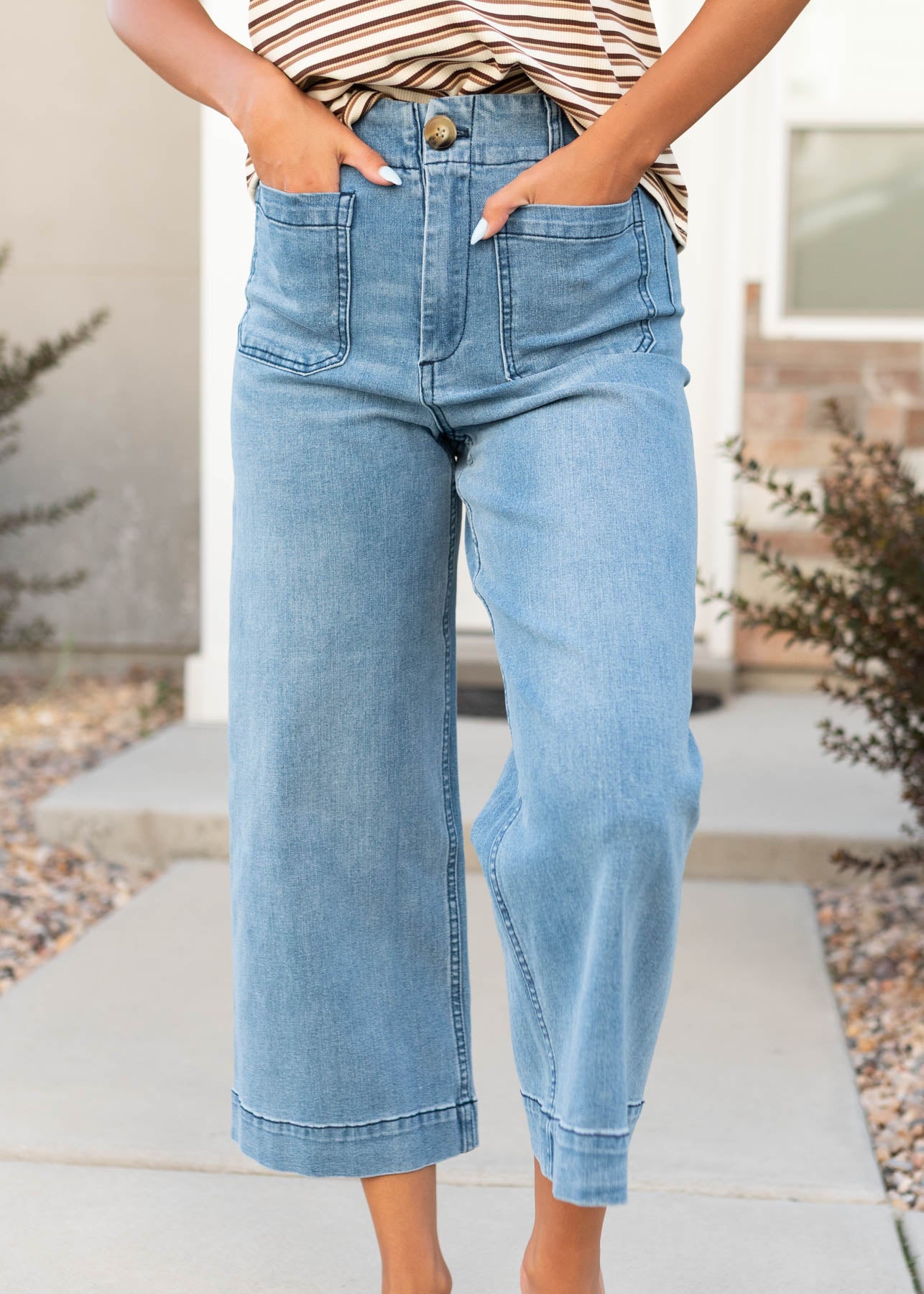Dark denim pants with wide hem