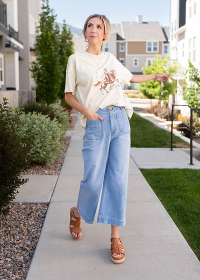 Denim pants that have a wide leg and are cropped