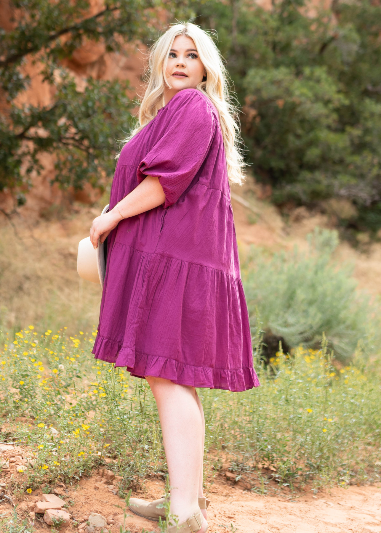 Side view of a plus size berry dress