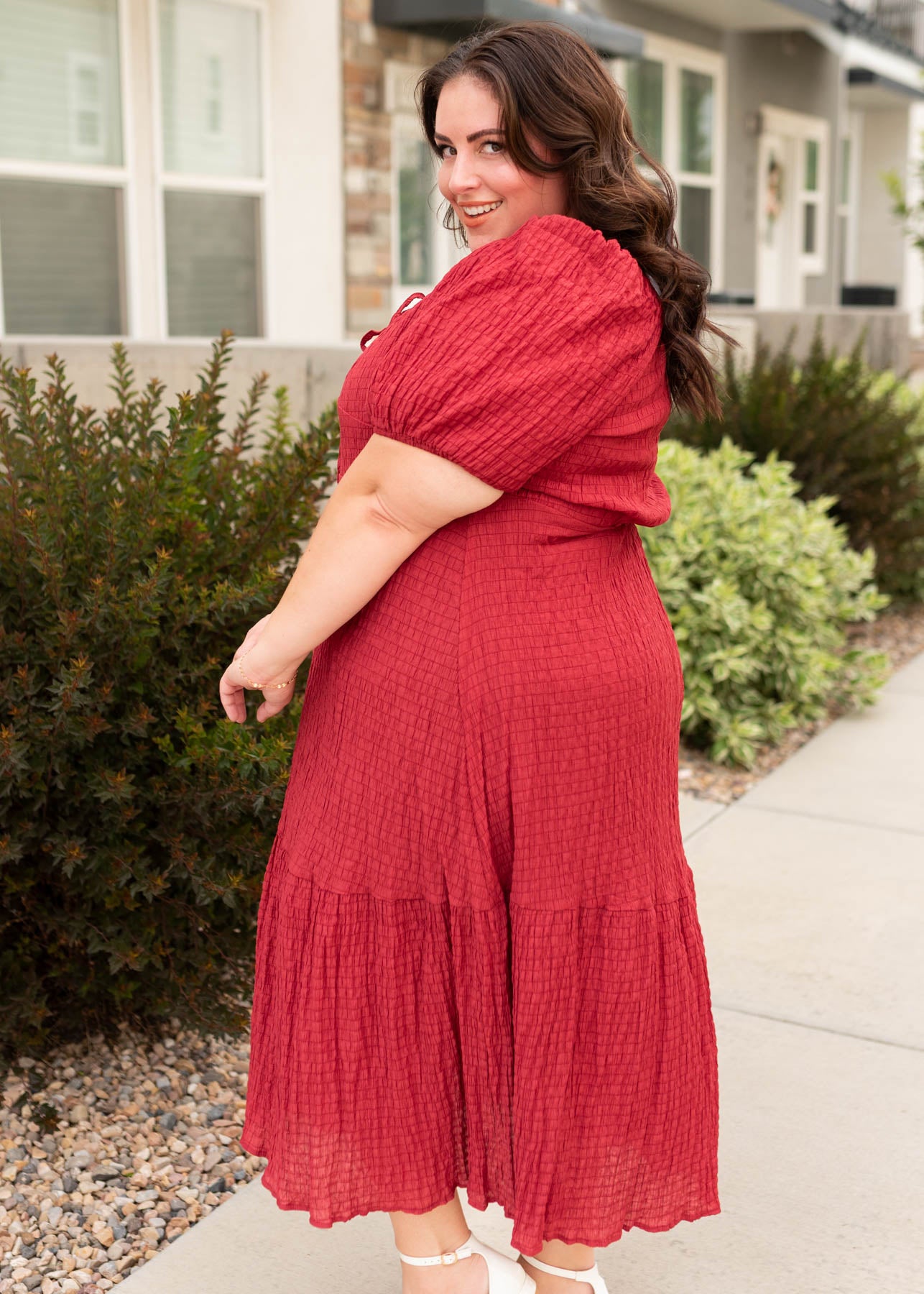 Side view of the modest plus size burgundy textured dress