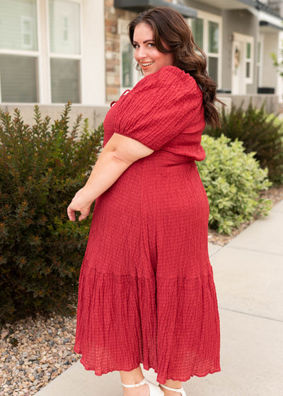 Side view of the modest plus size burgundy textured dress