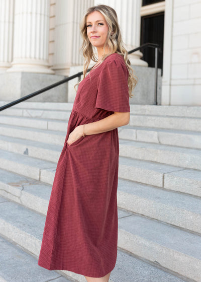 Side view of the dusty marooon dress with pockets