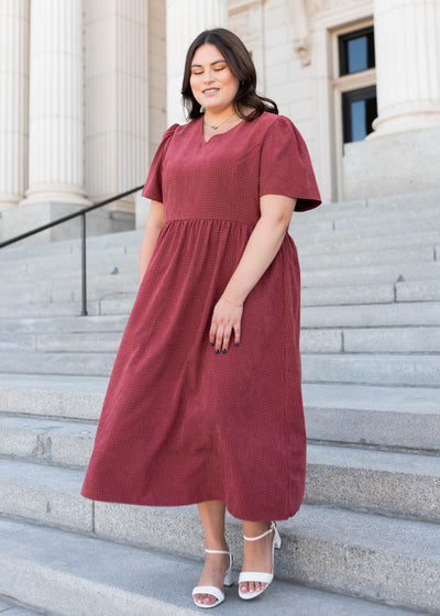 Plus size dusty maroon dress with a vneck in sizes 1x to 3x