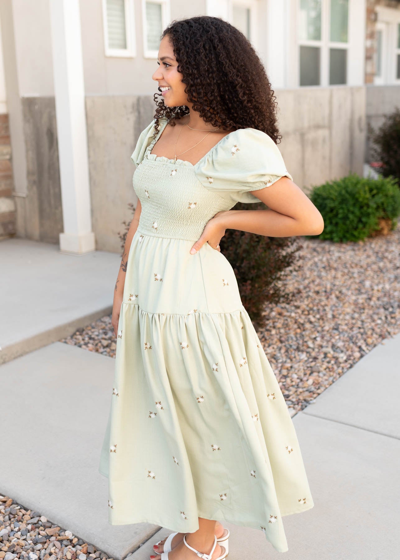 Side view of the olive puff sleeve dress
