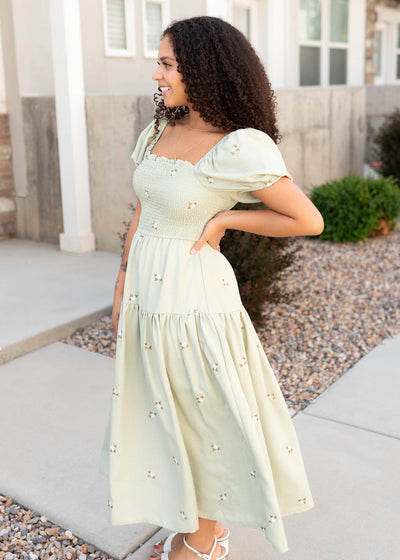 Side view of the olive puff sleeve dress