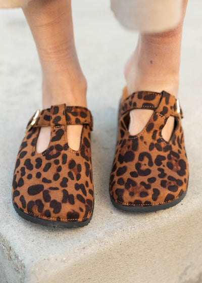Leopard print clogs with cutouts and silver buckle