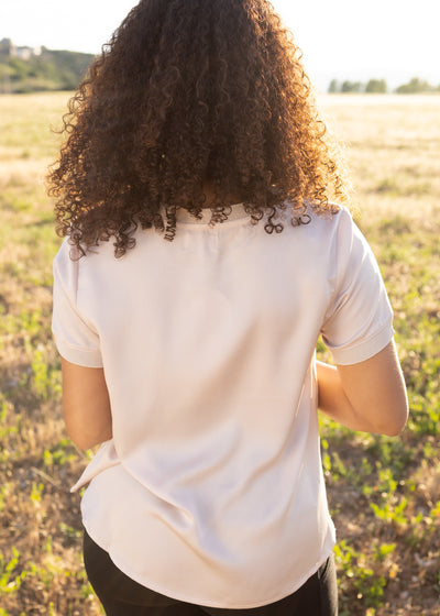 Back view of a blush top