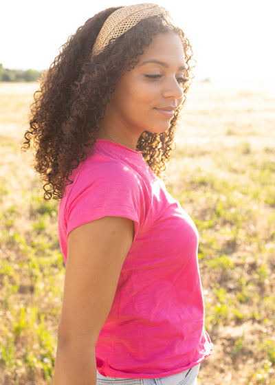 Side view of a short sleeve hot magenta top