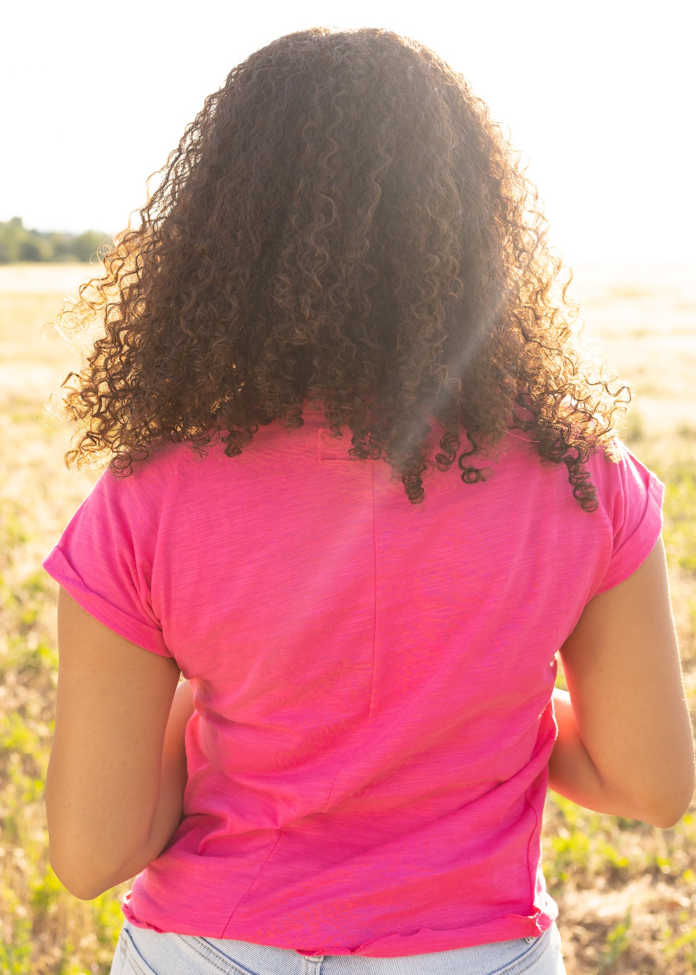 Back view of a hot magenta top
