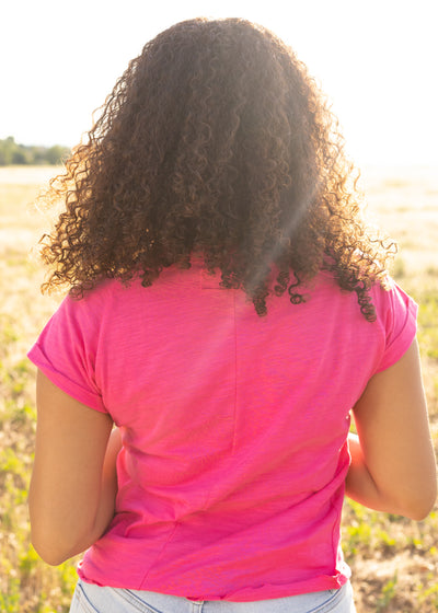 Back view of a hot magenta top