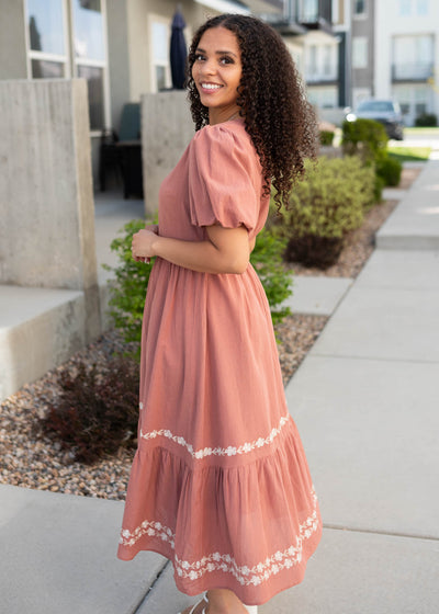 Side view of the dark rose embroidered dress