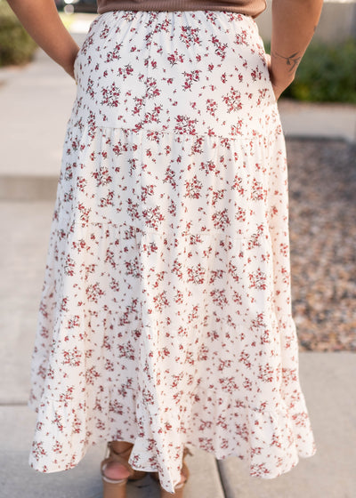 Back view of the tan floral skirt with red flower