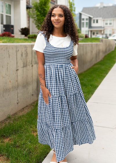 Tiered skirt on the navy gingham sleeveless dress