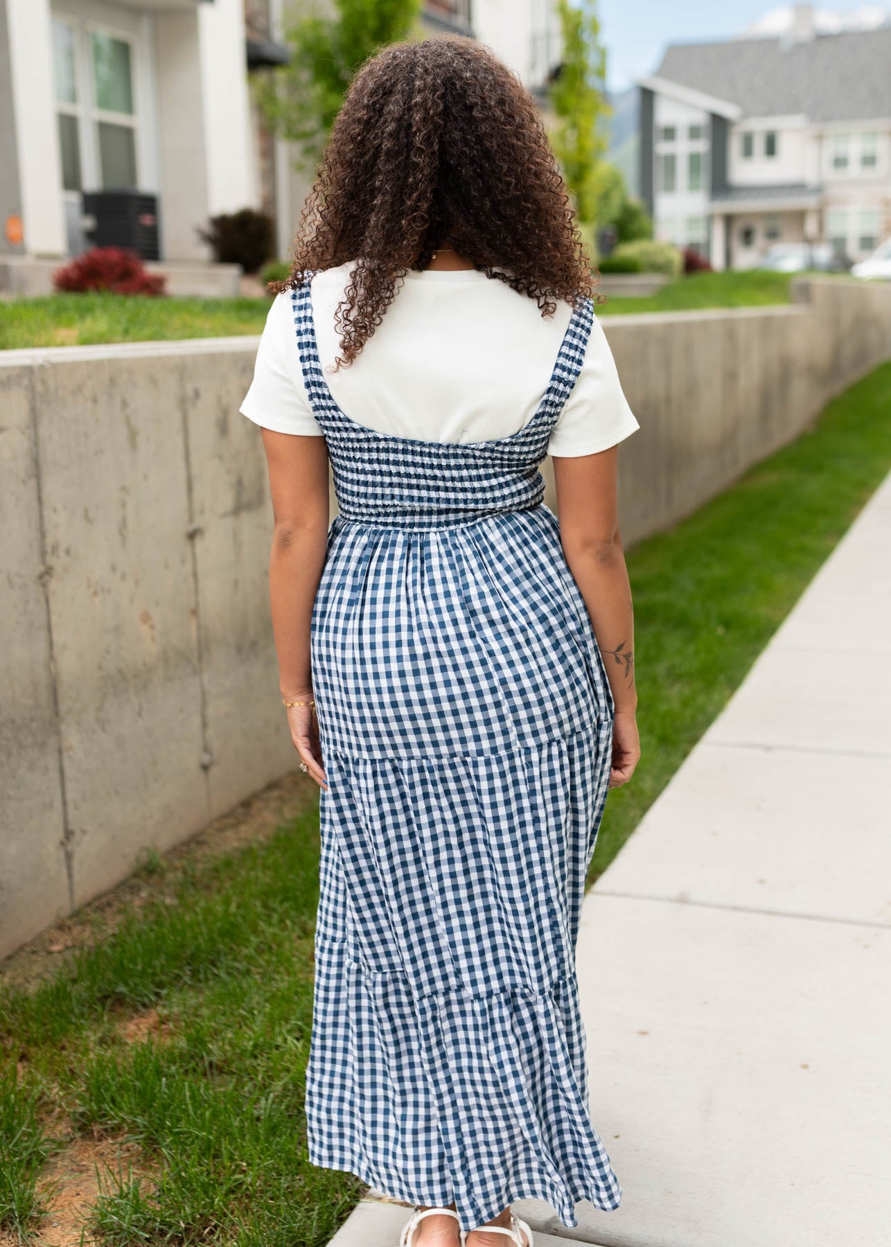 Back view of the navy gingham sleeveless dress