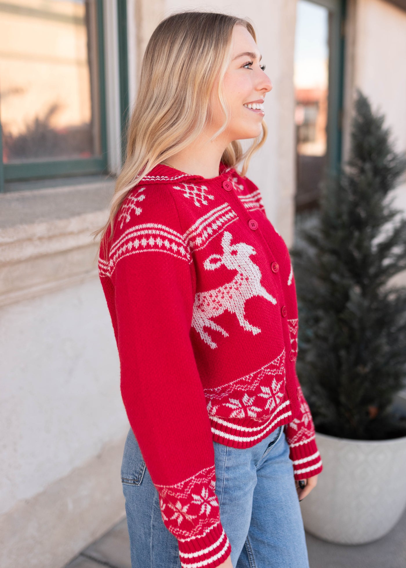 Side view of the red patterned cardigan