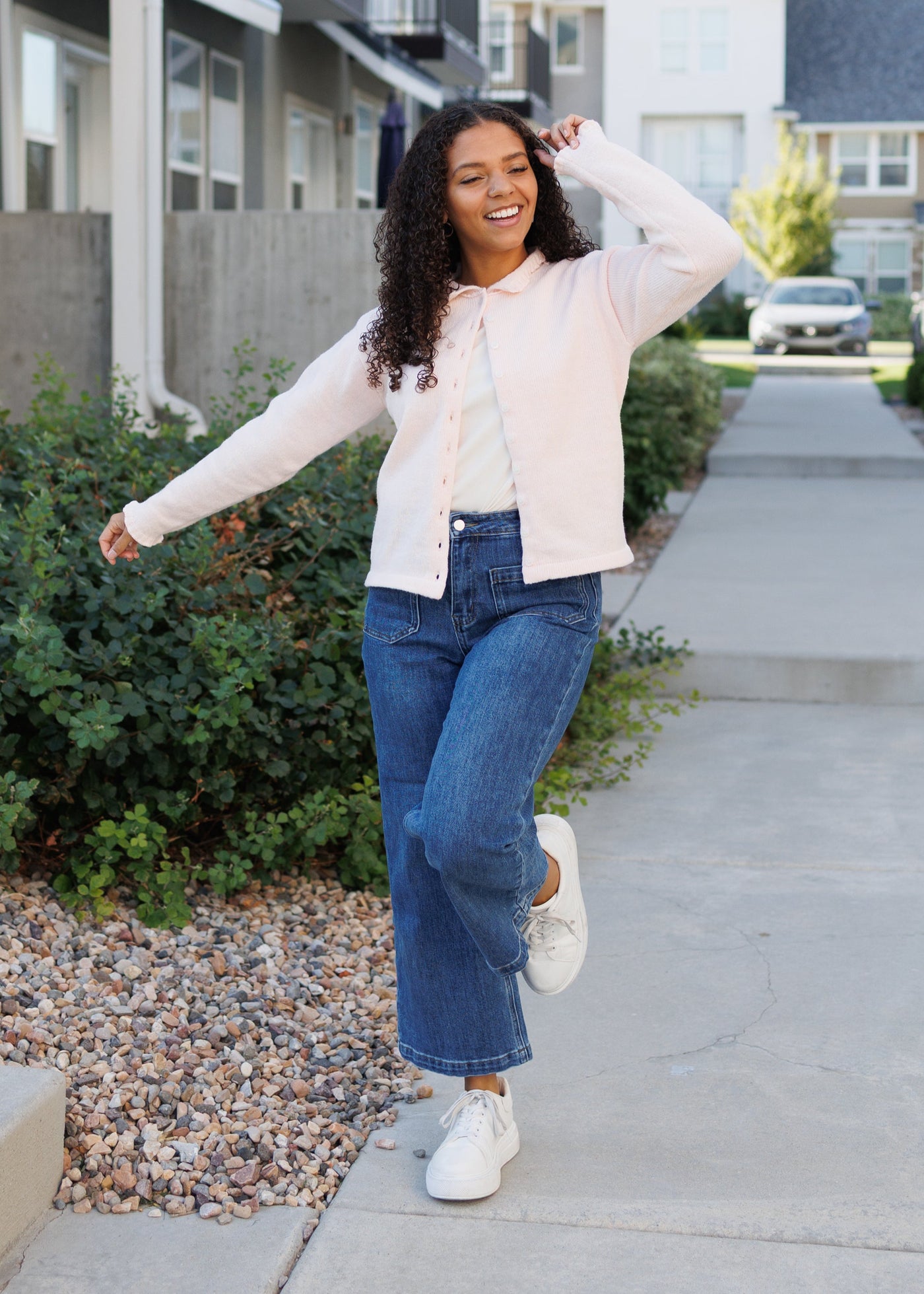LIght pink cardigan with a slight collar