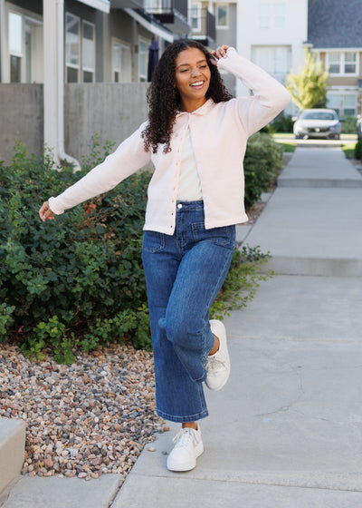 LIght pink cardigan with a slight collar