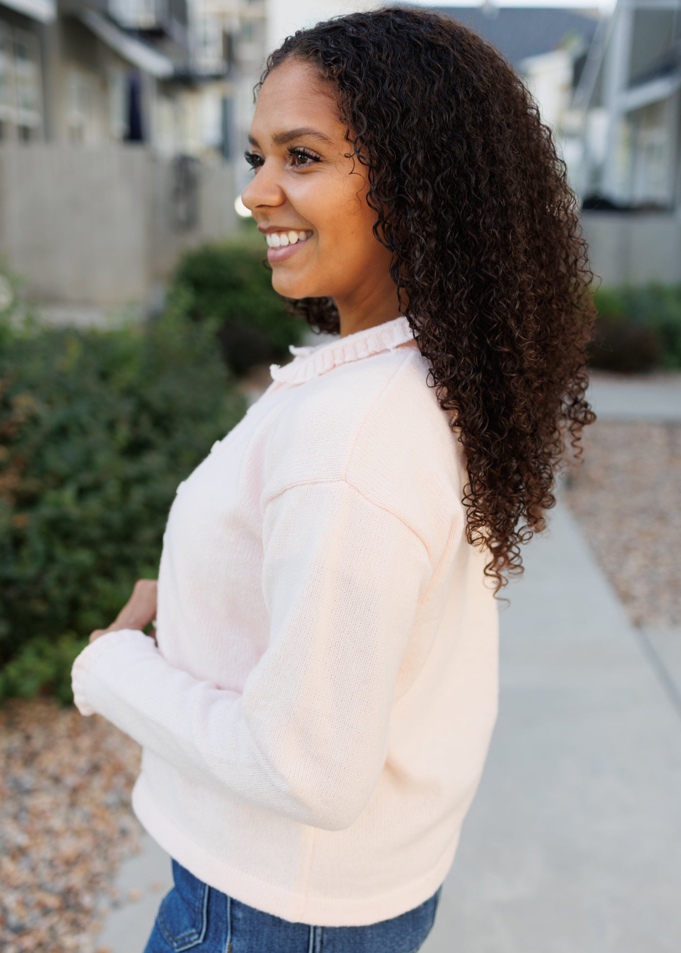 Side view of the lith pink cardigan