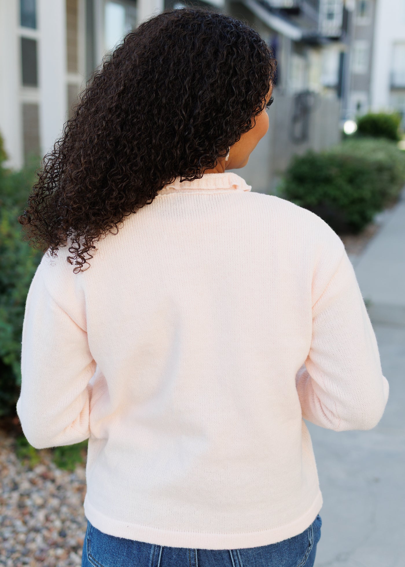 Back view of the light pink cardigan 