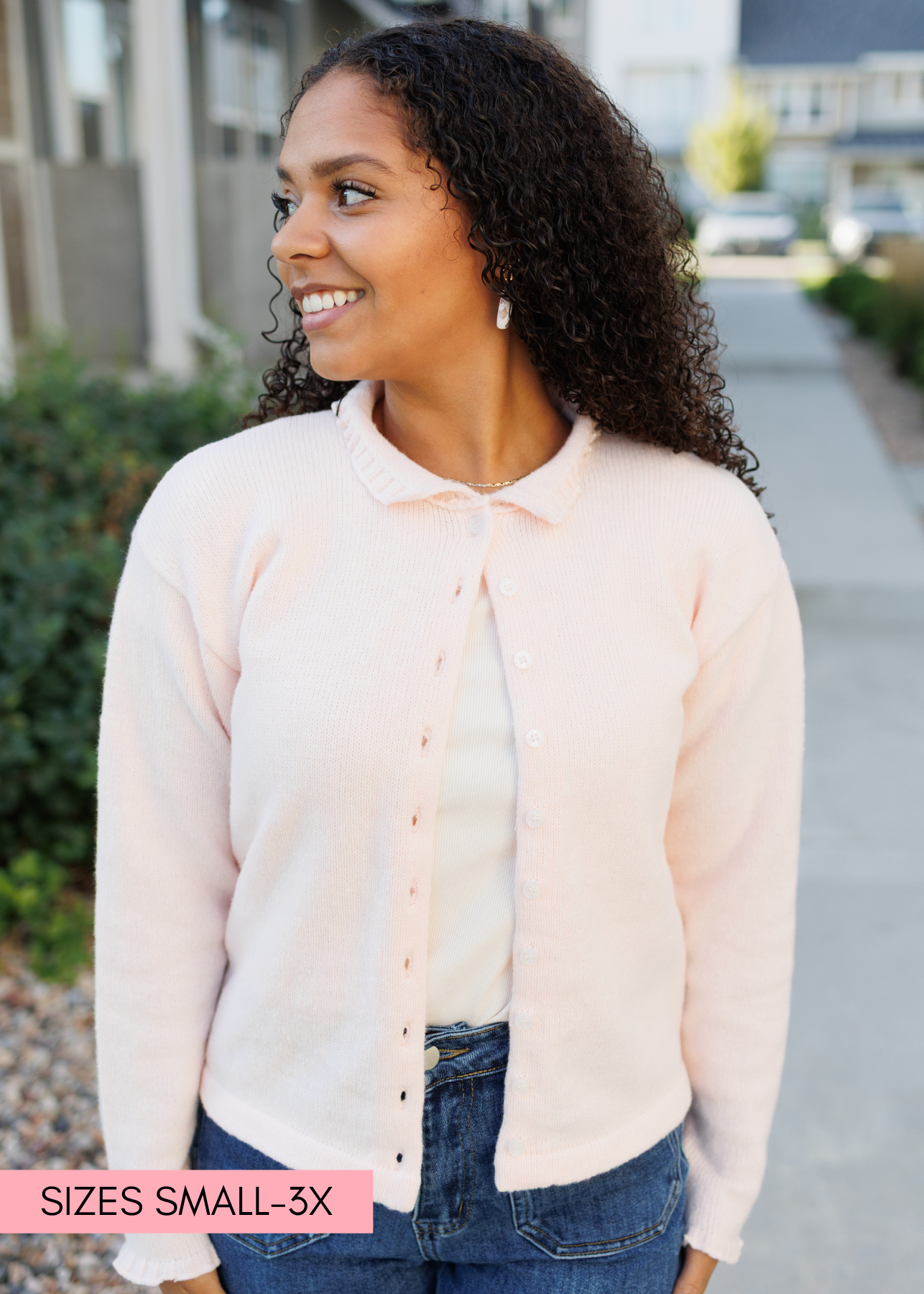 Button up light pink cardigan with ruffles on the cuffs and collar