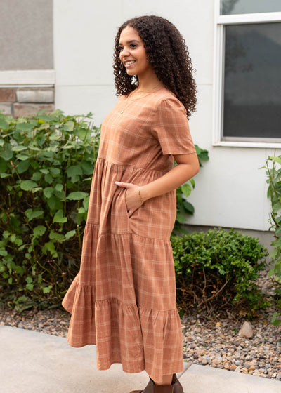 Side view of the cinnamon plaid dress with pockets