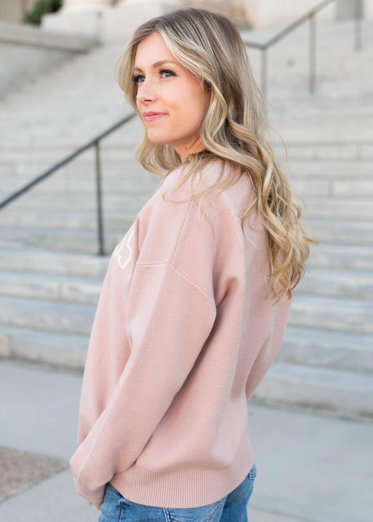 Side view of the happiness blush sweater
