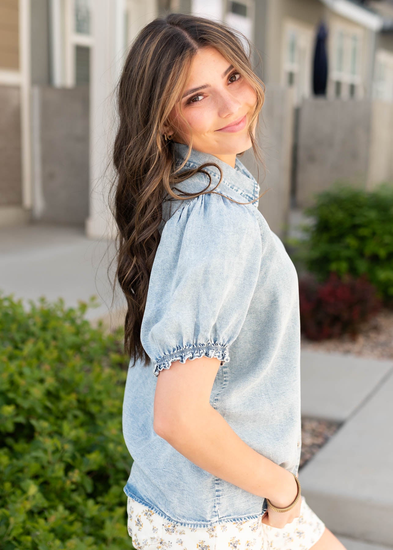 Side view of the chambray puff sleeve shirt