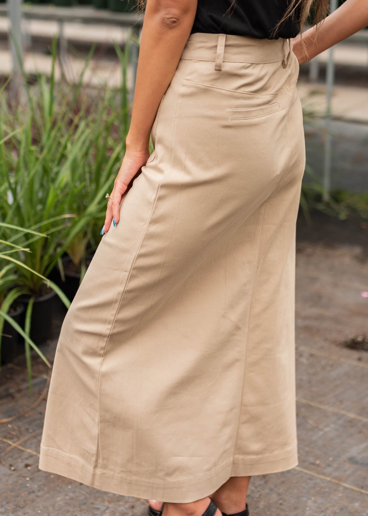 Side view of the taupe button down skirt