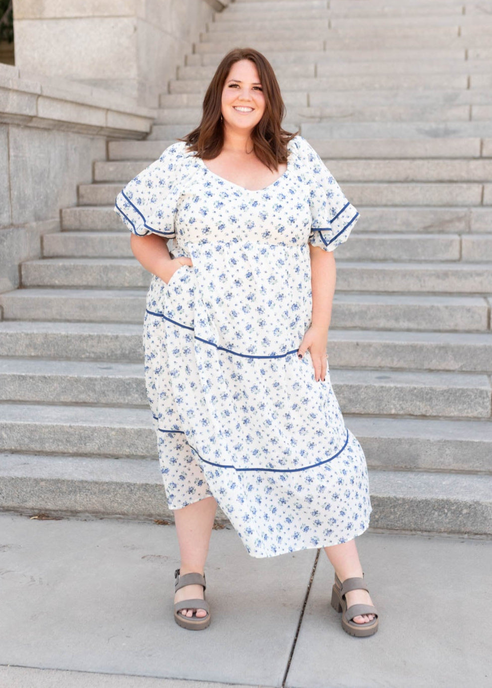Wide v-neck and navy trim on the plus size cream floral pattern dress