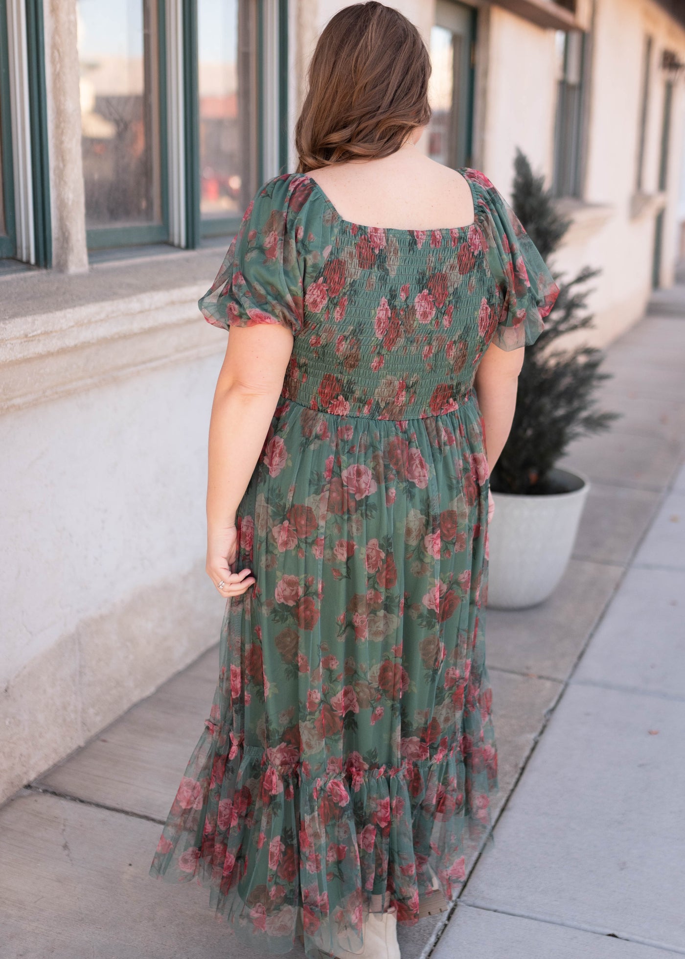 Back view of the floral greent tulle dress in plus size