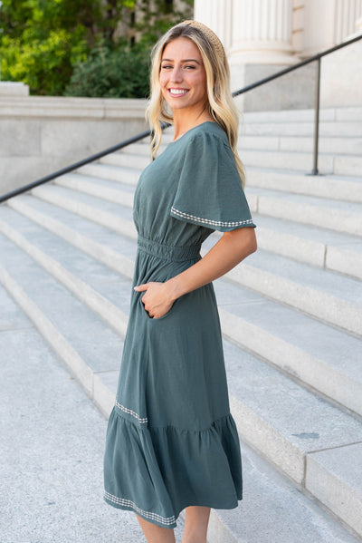 Side view of the the jade embroidered dress
