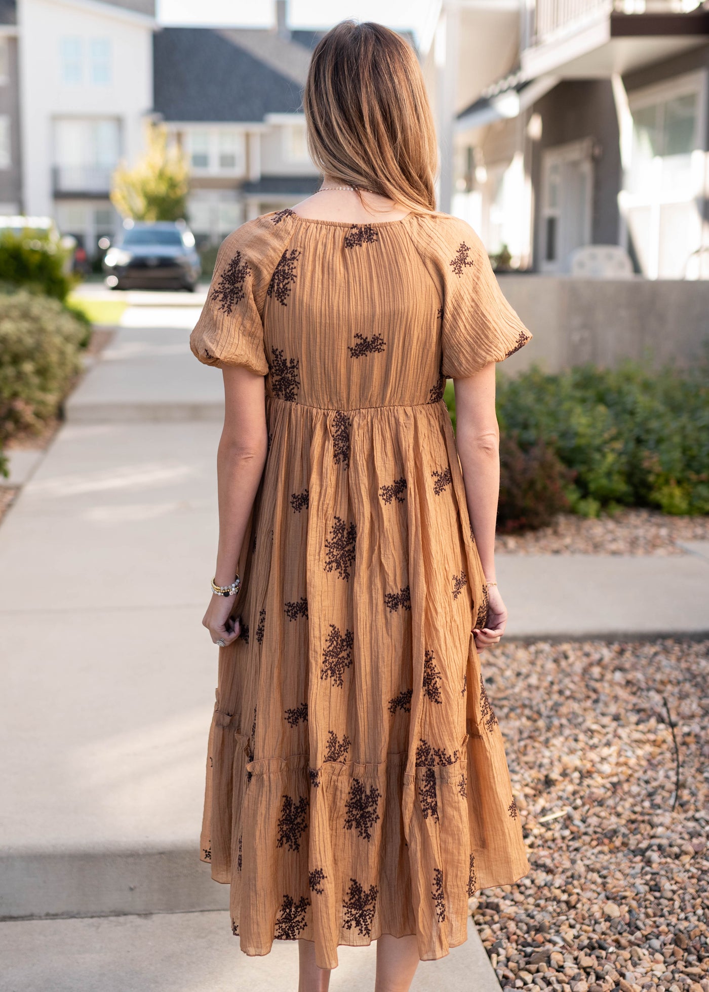 Back view of the tan embroidered dress
