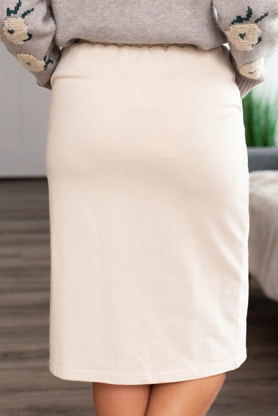 Back view of a oatmeal knit skirt