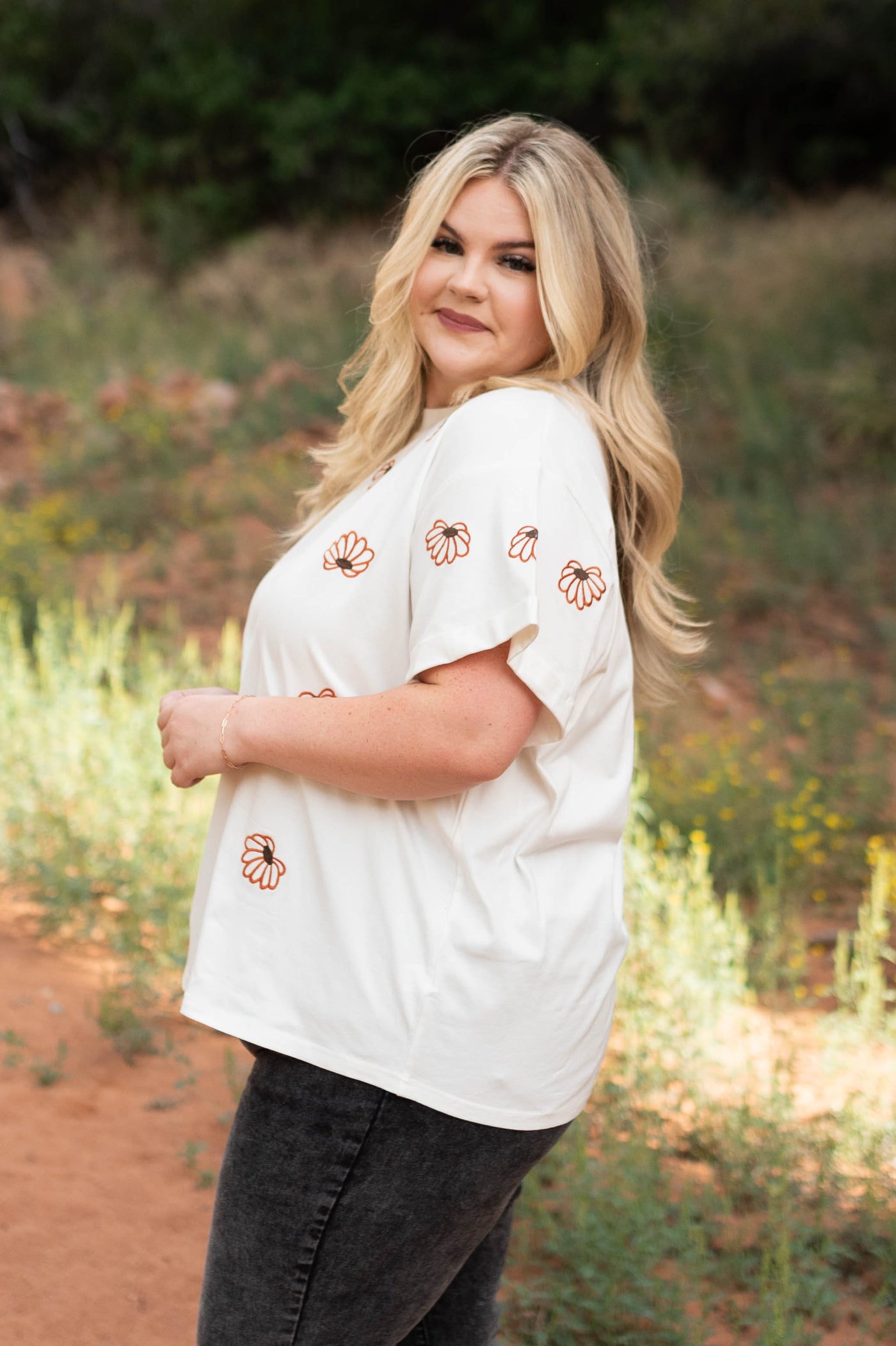 Side view of a ivory floral top