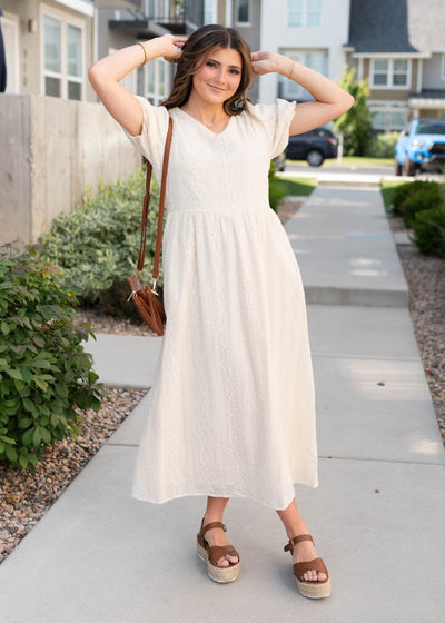 Cream embroidered dress with v-neck and pockets