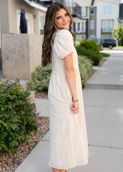 Side view of the cream embroidered dress