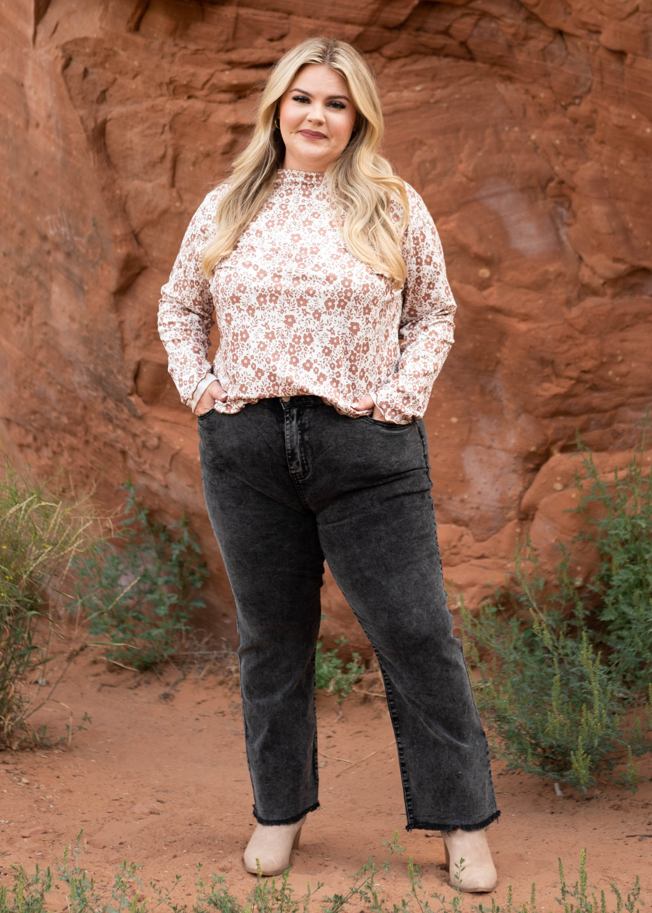 Plus size black pants with distressed hem