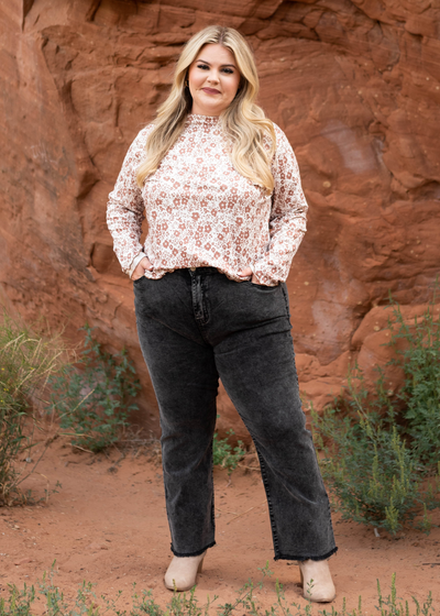 Plus size black pants with distressed hem