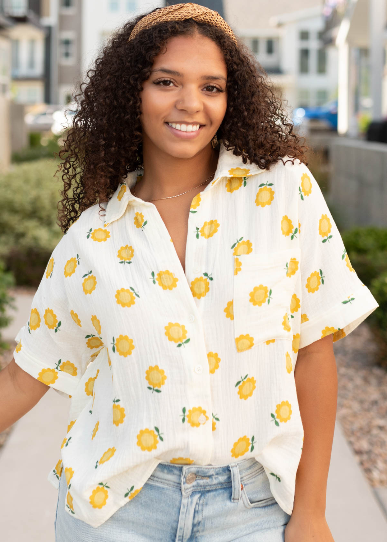 Button up with a collar on the ivory gold floral top