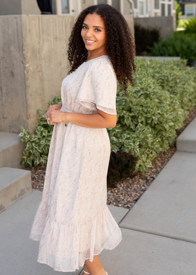 Side view of the beige floral dress