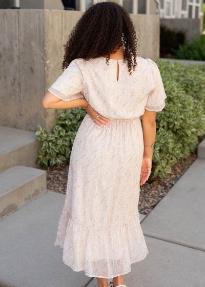 Back view of the beige floral dress